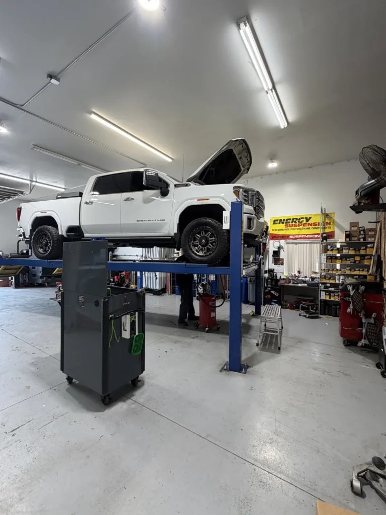 GMC truck on the lift for diesel maintenance Richland WA